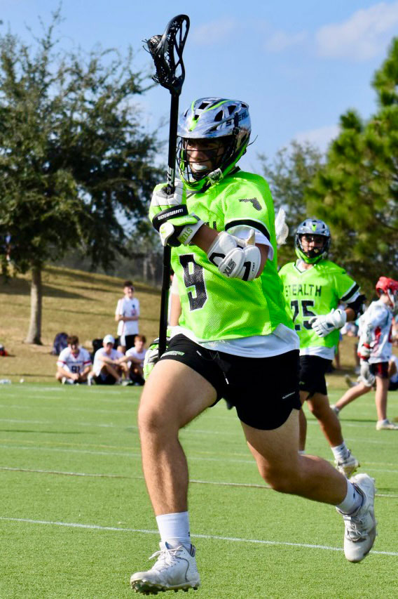 Logan playing lacrosse